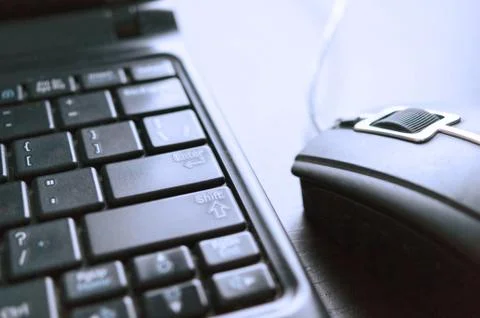 Closeup Image of Wired Computer Mouse and Laptop Keyboard. E-commerce, Online Stock Photos