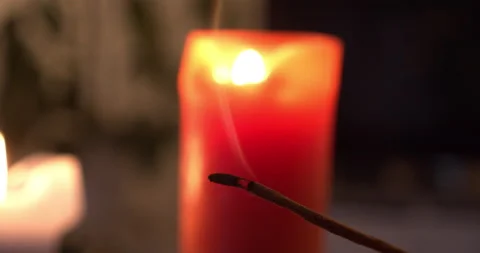 Closeup of incense burning. Candles on the background. Calm and tranquil Stock Footage 146177736