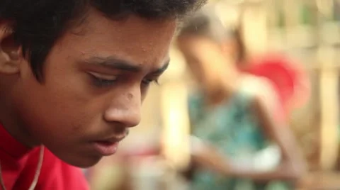Closeup of Indian boy studying and concentrating Stock Footage 65779061