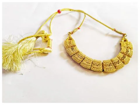 Closeup of Indian necklace, white background Stock Photos