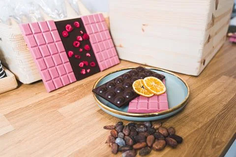 Closeup indoors shot of selection of dark and ruby chocolate with dried Stock Photos
