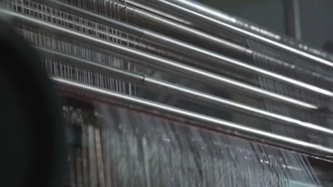 Closeup industrial knitting machine producing fabric, metal needles Stock Footage 321890965