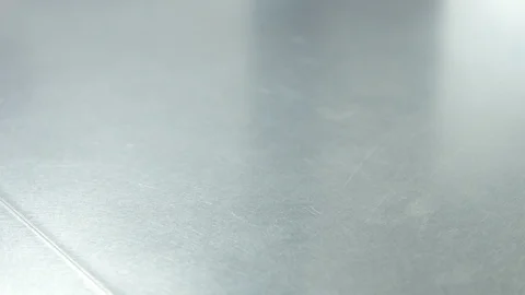 Closeup of inox table and man's hand putting a dish with croissant on it Stock Footage 87251298