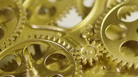 Closeup of intricate brass clockwork gears and mechanical watch movement Видео 346077180