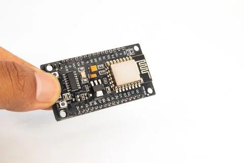 Closeup of an IOT (Internet of Things) module holding hands. This module is u Foto stock