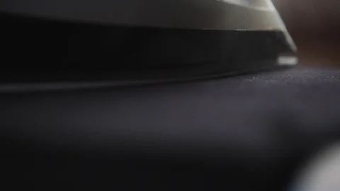 Closeup of an iron using steam ironing clothes and things 스톡 동영상 111565000