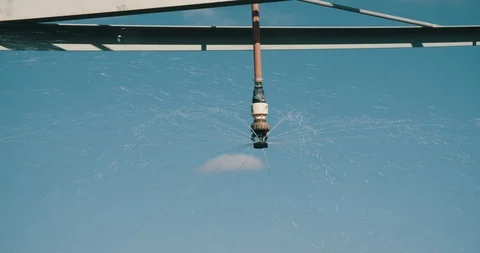 Closeup of irrigation machine nozzle spraying water at farm Video stock 120579377