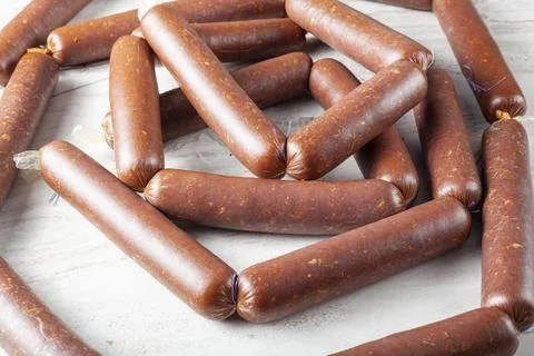 Closeup isolated image of strings of homemade sucuk or sausage stuffed in cas Stock-Fotos