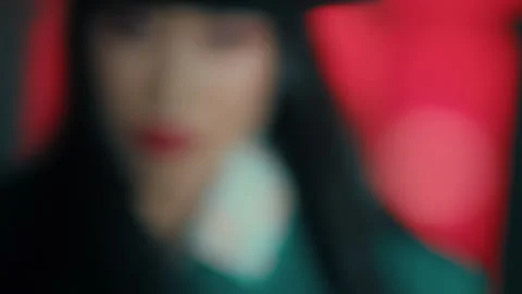 Closeup of a Japanese Dancer with a hat in front of a house with red light .. Stock Footage 274944605