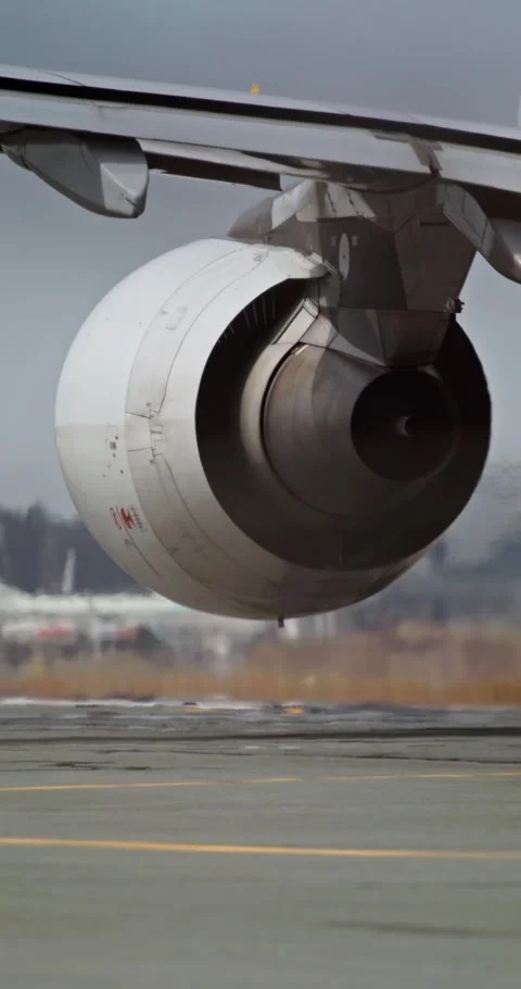 Closeup of jet engine and wing as airplane decelerates postlanding Stock Footage 307067985