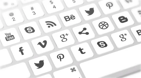 Closeup on keyboard buttons being pressed with social media icons on keys Stock Footage 56970743