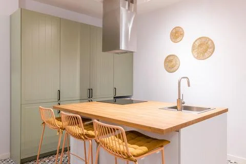 Closeup of kitchen table with trendy design high chairs. Wooden top and chairs Stock Photos