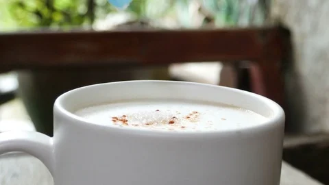 Closeup of lady pouring sugar while preparing hot coffee cup Stock Footage 81183391
