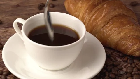 Closeup of lady pouring sugar while preparing hot coffee cup. Stock Footage 84771306