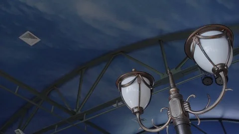 Closeup of lantern and building facade with flower decor in summer day. Stock Footage 119482748