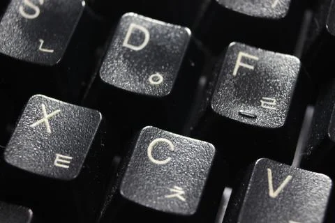 Closeup of laptop computer keyboard black keys with white letters and numbers Stock Photos