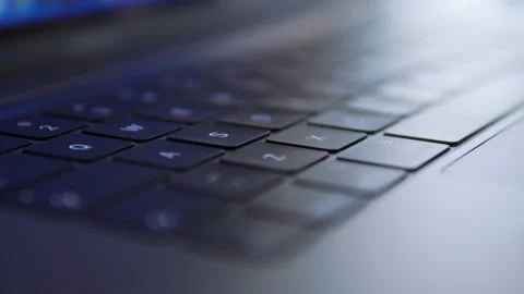 Closeup laptop keyboard on table in cafe Indoor depth of field in 4k Slow motion Stock Footage 146452907