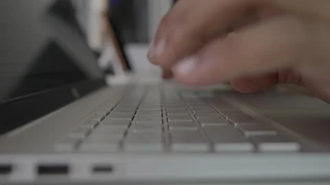 Closeup laptop keyboard typing by hand on white table Stock Footage 293515047