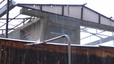 Closeup of large drops of intense rain falling on the calamino roof on the roof Stock Footage 164620305