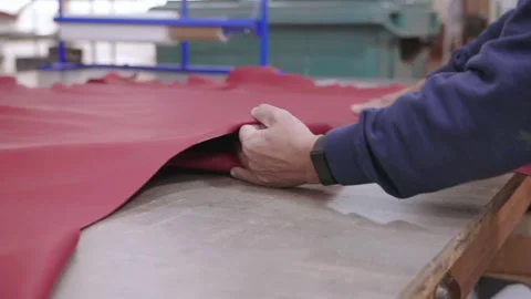 Closeup on a large red piece of leather, slowmotion Stock Footage 137588676