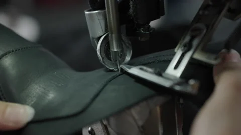 Closeup of Leather Shoe Upper Being Sewn by Hand with Industrial Machine in Stock Footage 341666929