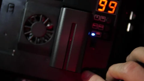 Closeup LED Light lamp charged Lithium Li-ion Battery NP F750 F770 5000mAH Stock Footage 119169587