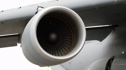 Closeup Of Left Jet Turbine Engine Moving Flying In Sky Stock Footage 121172301