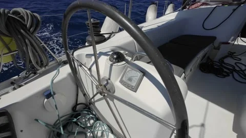 Closeup on left  sailing boat winch and helm looking through steering Stock Footage 238942745