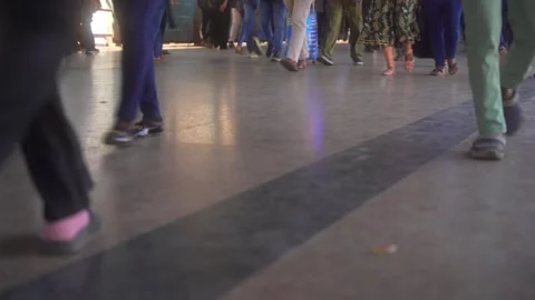 Closeup of legs, Crowd of people walking on railway overbridge floor, crowded Stock Footage 309293115