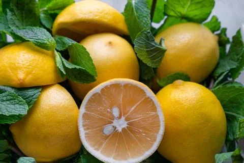 Closeup lemons with mint sliced in half. Fruits with Vitamin C. Enhancing Stock Photos