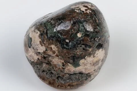 Closeup leopard jasper tumbled stone showing glossy surface and mottled green Stock Photos