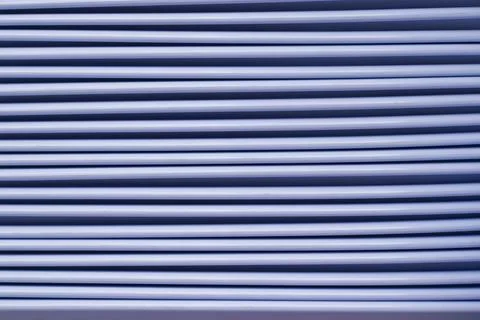 Closeup of light blue horizontal lines with a dark blue background Stock Photos
