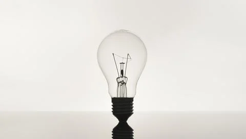 Closeup of lightbulb on white background, Creative idea and innovation concept Stock Photos