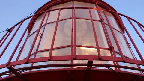 Closeup of Lighthouse top with lamp rotation mechanism in action. Stock Footage 94457497