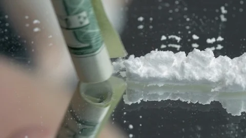 Closeup of a Line of Cocaine Being Snorted Stock Footage 90057998