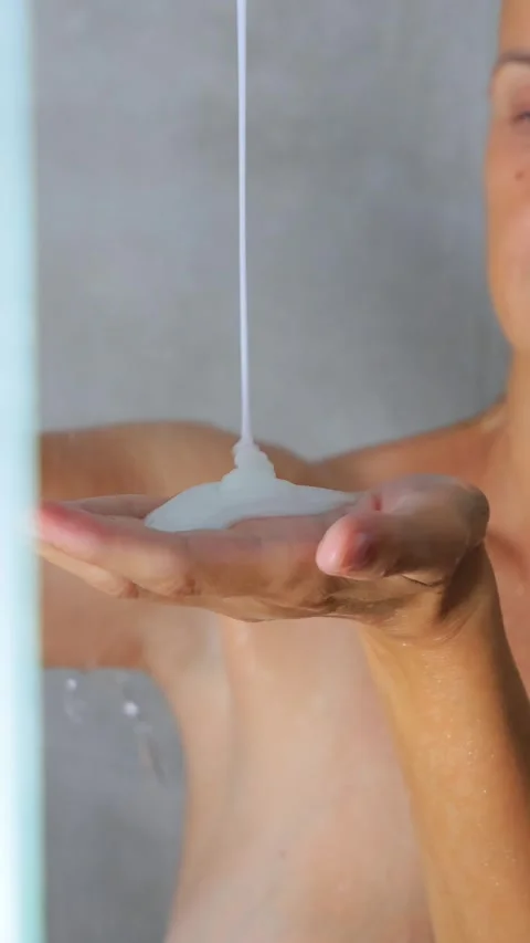 Closeup of Liquid Soap or Shampoo Pouring into Hand Stock Footage 315184119