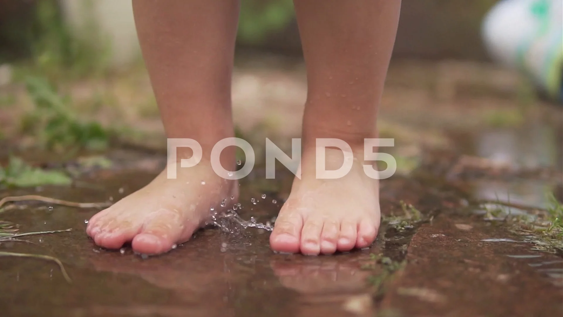 Closeup Of Little Boys Feet As He Walks Along Wet Path Video 80238040 Closeup Of Little Boys Feet As He Walks Along Wet Path Video 80238040