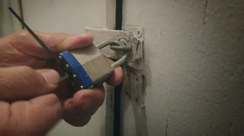 Closeup locksmith lockpicker picking opening lock on old door. 4K UHD. Stock Footage 62799645