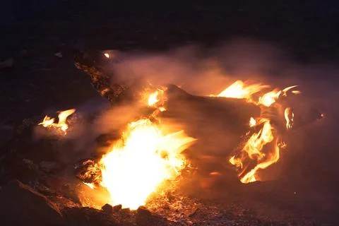 Closeup of a log burning in a forest fire, Flagstaff, Arizona. Stock Photos