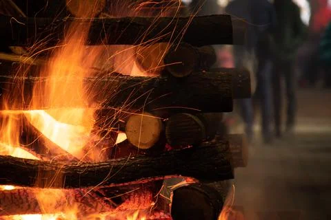 Closeup of a log campfire in the city Stock Photos