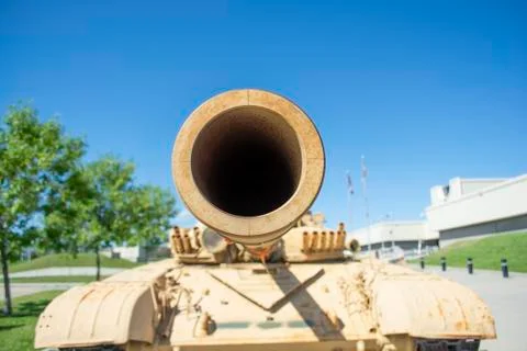 Closeup looking down the barrel of a modern heavy armoured war tank's cannon Stock Photos