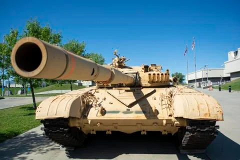 Closeup looking down the barrel of a modern heavy armoured war tank's cannon Stock Photos