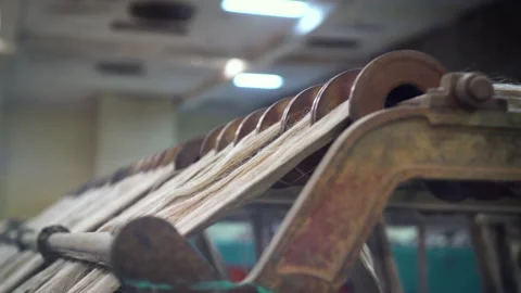 Closeup of a loom equipment in process. Weaving production. Video stock 136706807