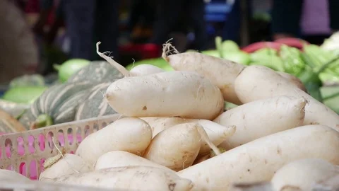 Closeup of a lot of vegetables in wicker baskets on the local market Stock Footage 81168080