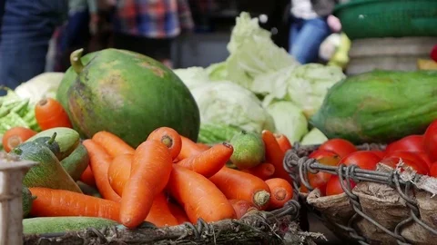 Closeup of a lot of vegetables in wicker baskets on the local market Video stock 81168192