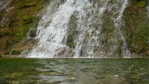 Closeup of the lower part of a waterfall in summer Stock-Footage 260833966