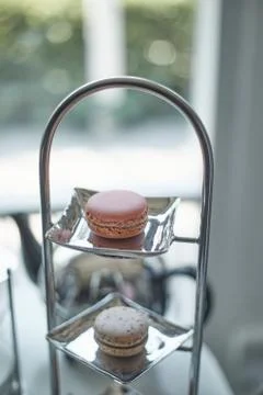 Closeup of macaron with tea set.. Stock Photos