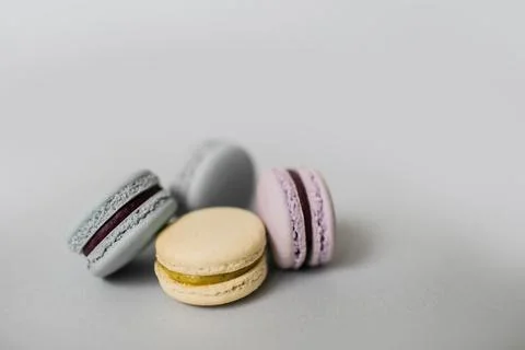 Closeup of macaroon or macaron biscuits on grey background. Stock Photos