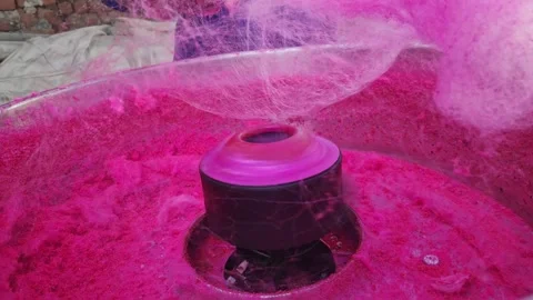 Closeup of a machine creating layers of cotton candy or candy floss Stock Footage 243003974