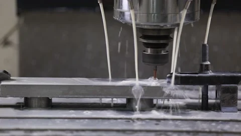 Closeup of machine fluid on CNC processing machining center in the factory Stock Footage 239452643
